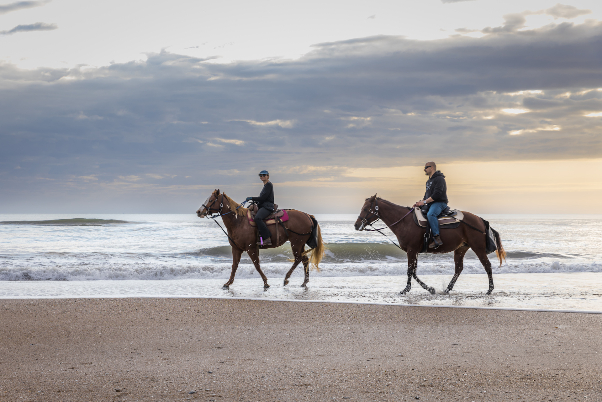 Horseback riding on sand